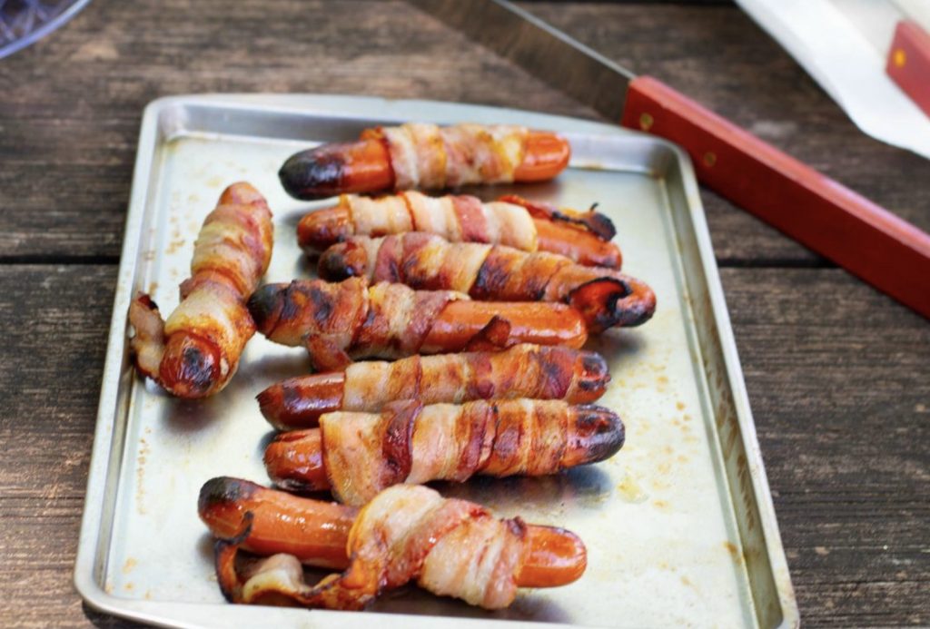 Campfire bacon wrapped hot dogs. 
